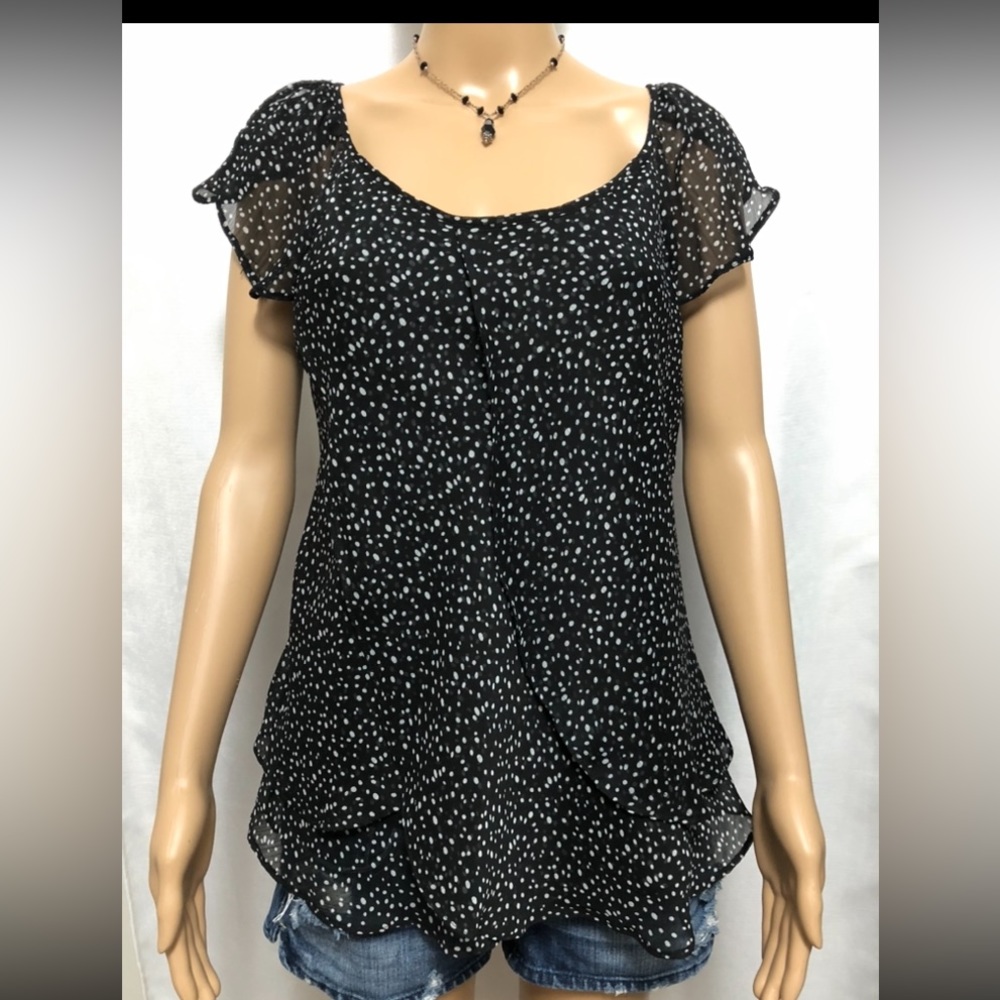 Black and white print flutter sleeve blouse.